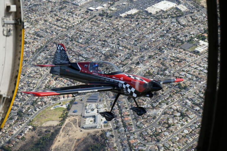 Rob Holland, piloting his MXS-RH, next to the Golden Knights, performs aerobatics during the 2022 Marine Corps Air Station Miramar Air Show at MCAS Miramar, San Diego, California, Sept. 24, 2022. Holland has been performing at air shows for over 18 years. The theme for the 2022 MCAS Miramar Air Show, “Marines Fight, Evolve and Win,” reflects the Marine Corps’ ongoing modernization efforts to prepare for future conflicts. (U.S. Marine Corps photo by Pfc. Arthur Shores)